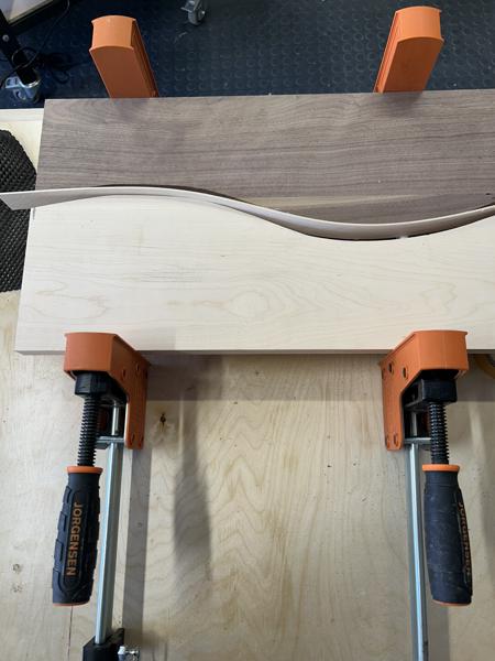 One of the two cross-matched boards is ready for glue-up with a thin maple strip inserted into the saw kerf.